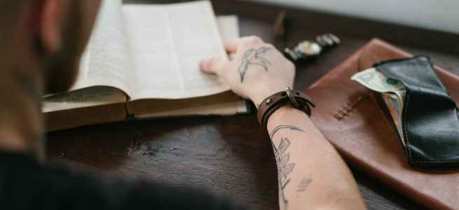 Glossary cover photo showing modern male studying in library